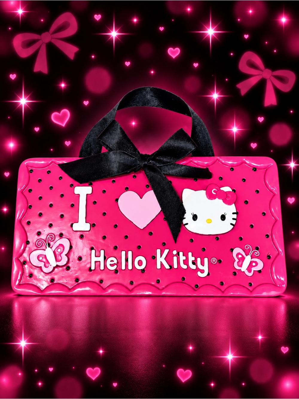 Hello Kitty pink ceramic hanging wall sign with black ribbon.